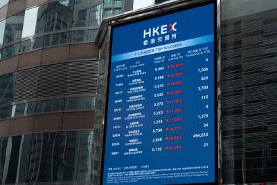 An electronic board displays various stock prices at Exchange Square