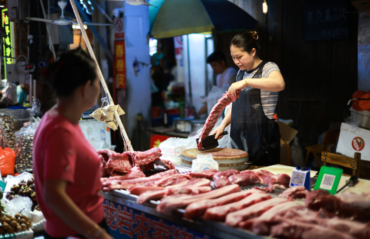 A vendor sales pork at a market in Xiamen, in