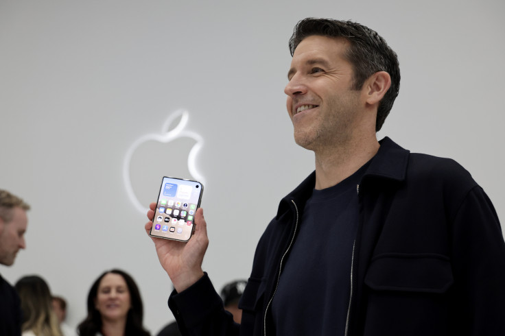 CUPERTINO, CALIFORNIA - SEPTEMBER 09: Apple CEO John Ternus holds
